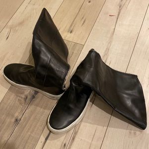 Sneaker platform boots with a zipper in the back.